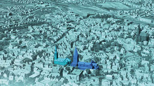 Vogelperspektive auf ein 3D Stadtmodell mit farblich hervorgehobenen Gebäuden